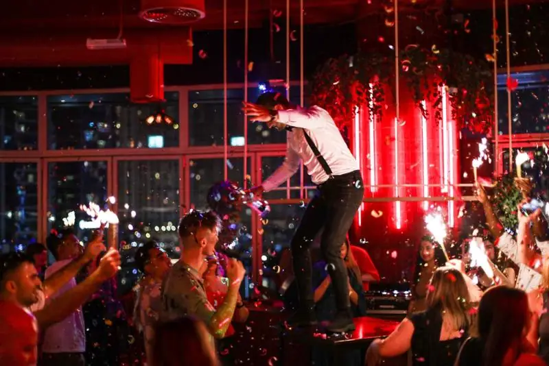 A performer on the tables with sparklers